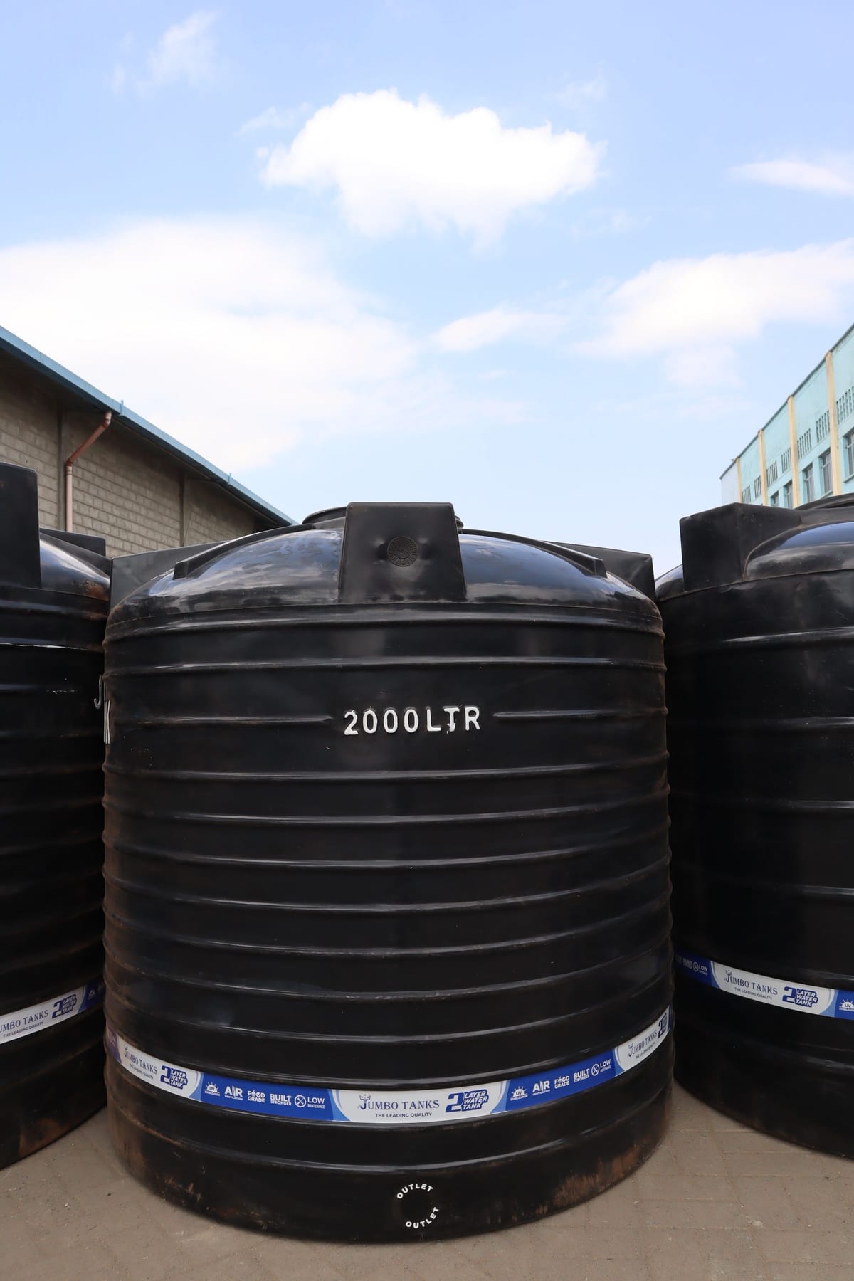 A 2,000 litre Jumbo Tank standing in the factory yard with the capacity moulded into the wall.