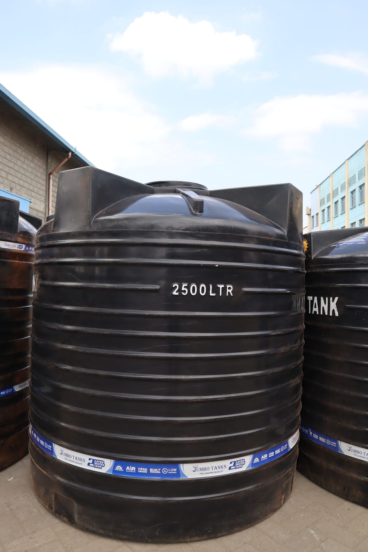 A 2,500 litre Jumbo Tank standing in the factory yard with the capacity moulded into the wall.